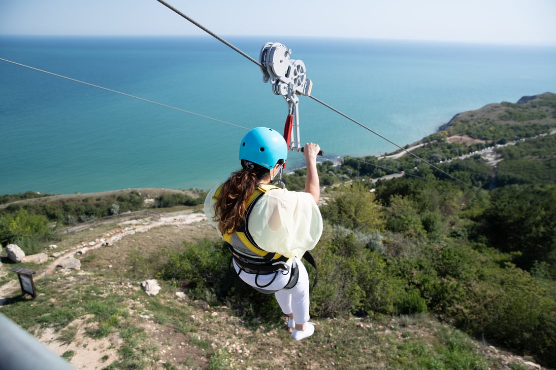 A Woman Riding a Zipline